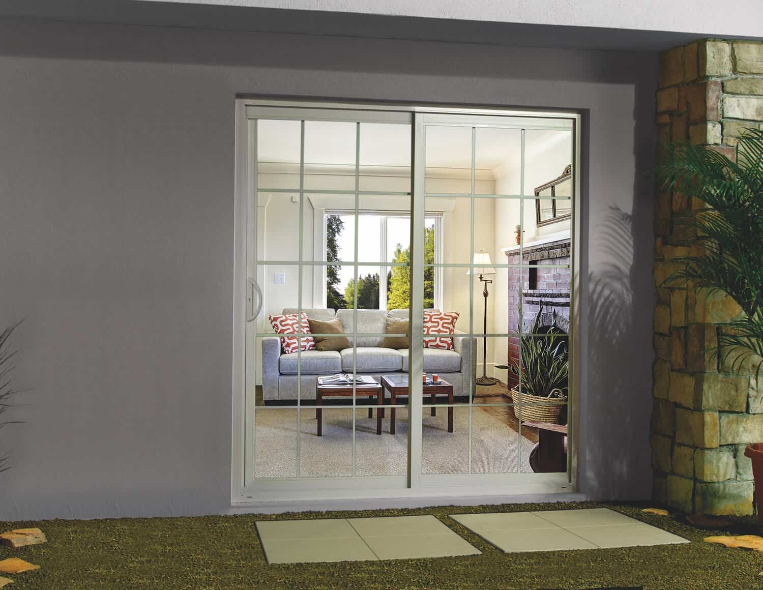 White framed sliding glass doors on a gray wall, looking into the living room